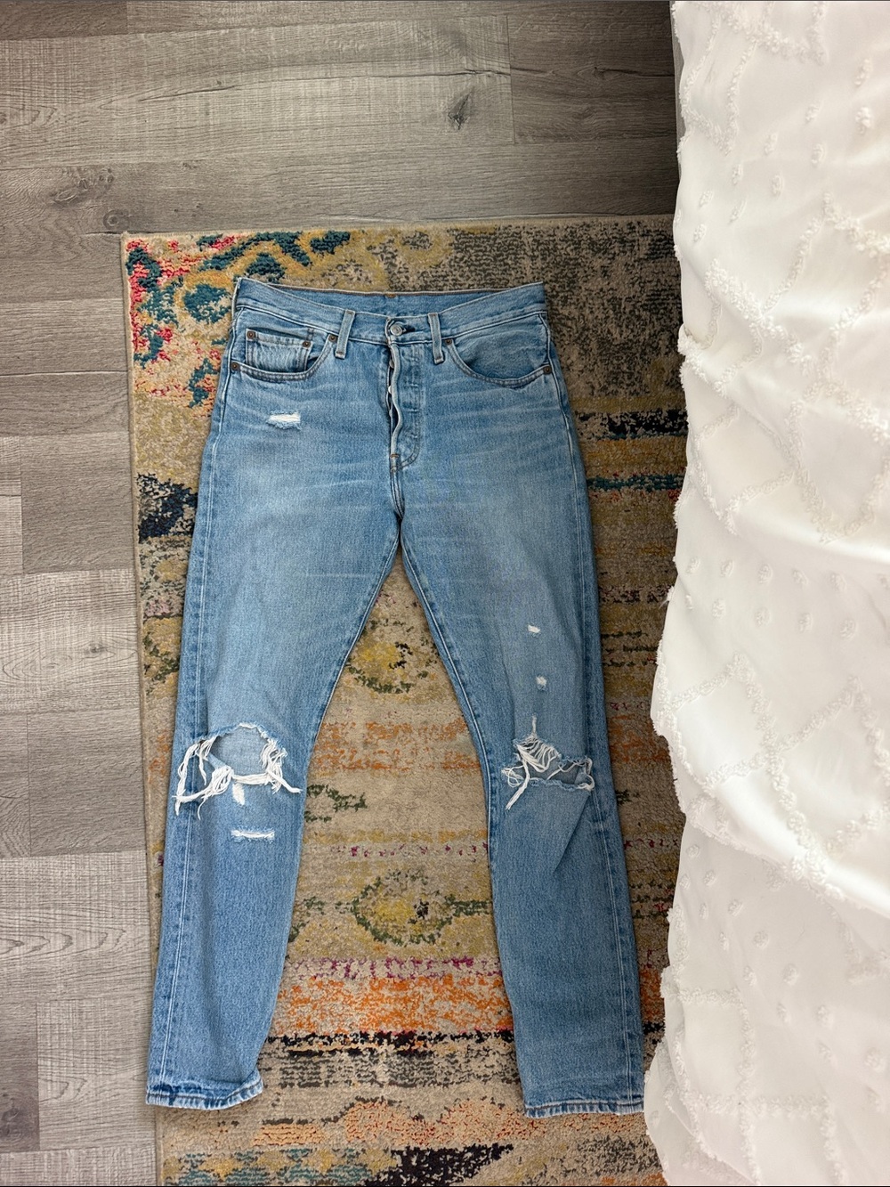 Levi’s 501 distressed light wash denim